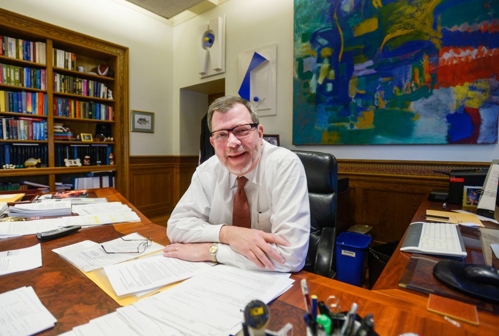 University president Eric Kaler discusses the hockey riots, new light rail and his summer plans in his office in Morrill Hall, Monday.