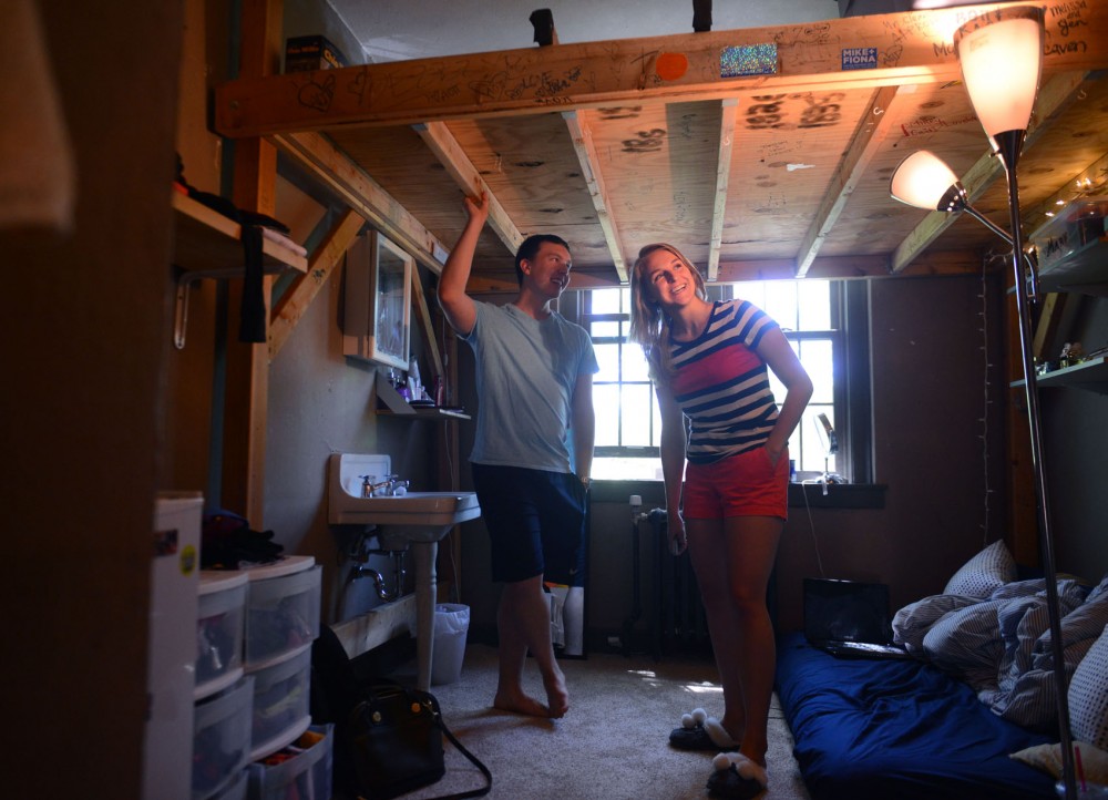 Senior political science major and sorority member Mary Carlson and president of Beta Theta Pi fraternity and senior graphic design major Nate Wong show Marys room for the summer in the Beta Theta Pi fraternity house.  