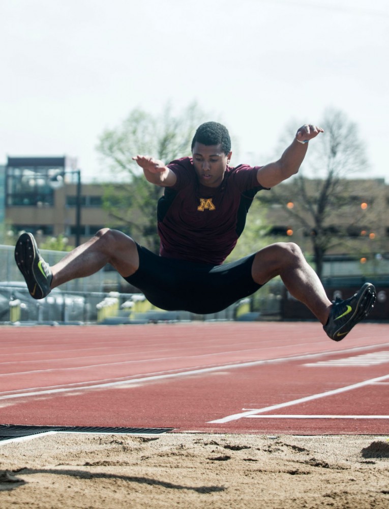 Freshman Trevor Yedoni runs to demonstrate his long jump at Bierman Track and Field Stadium on May 20. Yedoni was named Big Ten Freshman of the Year after having had two ACL tears, which have held him back from competing the past two seasons. 