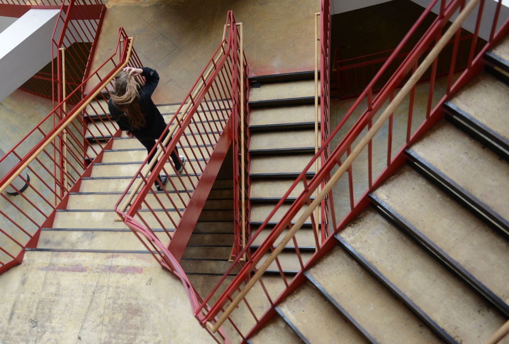 A student descends the stairs in a construction area of Keller Hall on Sunday.