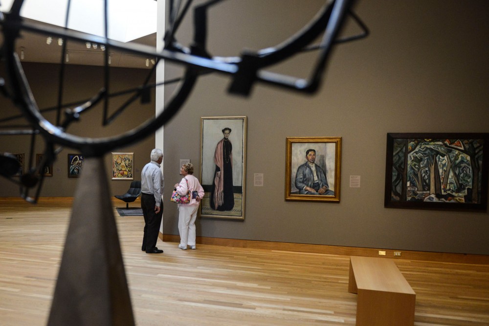 Paul Abbott and Janice Ott stroll through the Weisman Art Museum on Sunday.