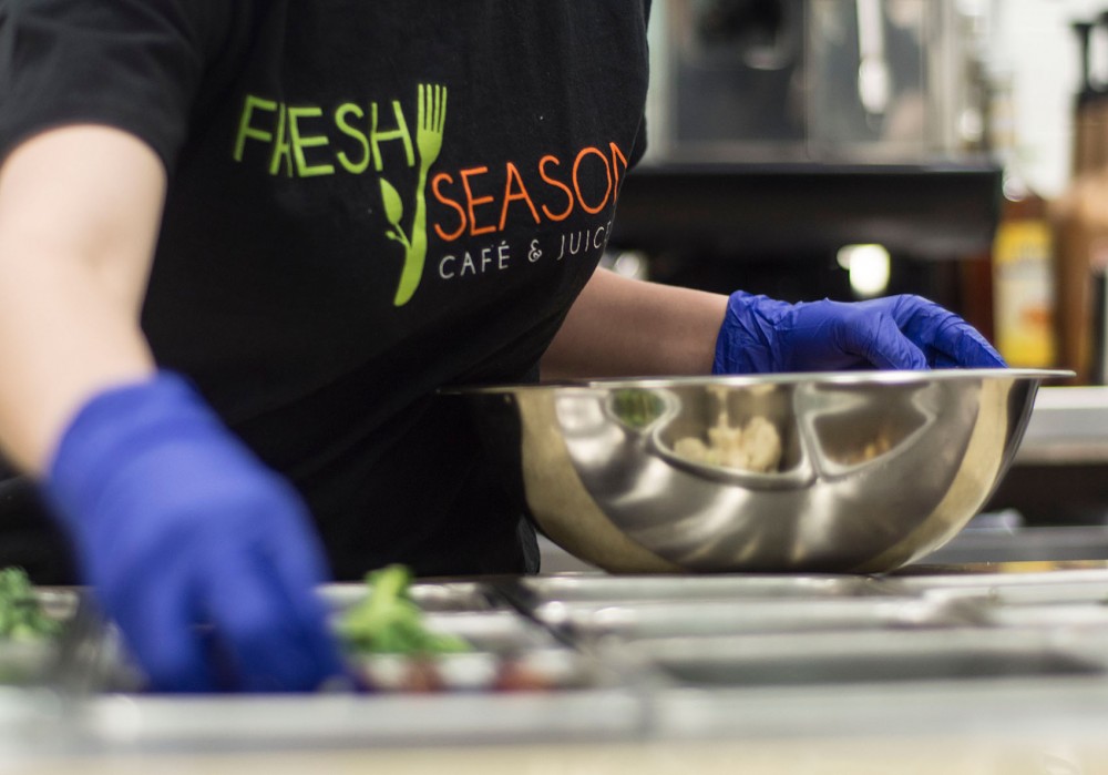 A worker prepares a custom juice drink at Fresh Seasons Cafe inside the University Recreation and Wellness Center on Thursday. 