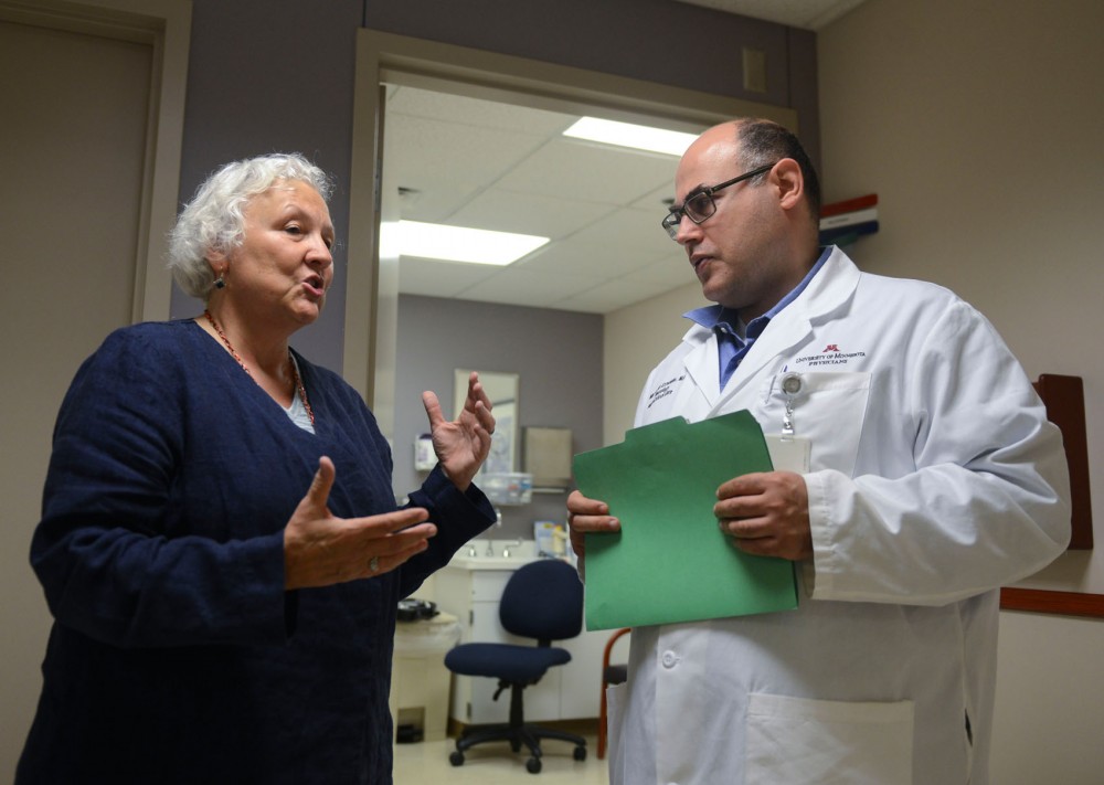 Principal investigator Mustapha Ezzeddine and co-principal investigator Michelle Biros of StrokeNet at the University meet in the Neurology Clinic on campus on Friday. 