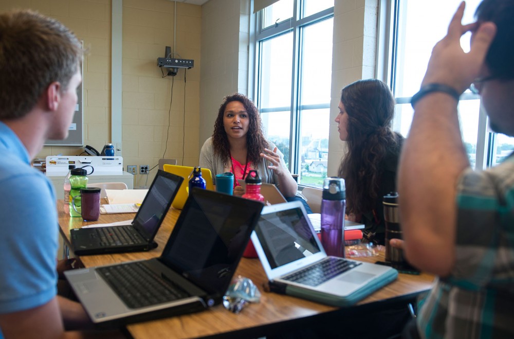 CEHD graduate student Clare Foley talks in a small group with other graduate students at Cityview Elementary School in Minneapolis on Tuesday morning. The U partnered with Teach For America to provide an alternate program for students to get their teaching license. 