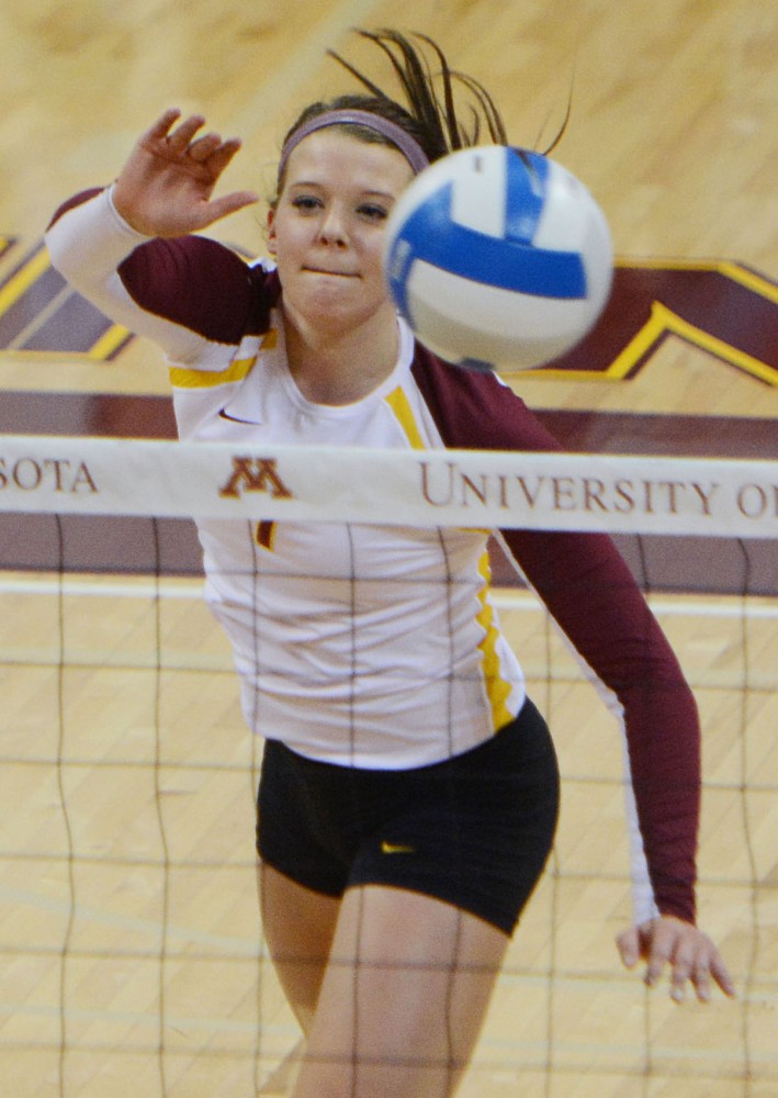 Minnesota middle blocker Hannah Tapp hit a ball over the net against Purdue on Sept. 28, 2013, at the Sports Pavilion.