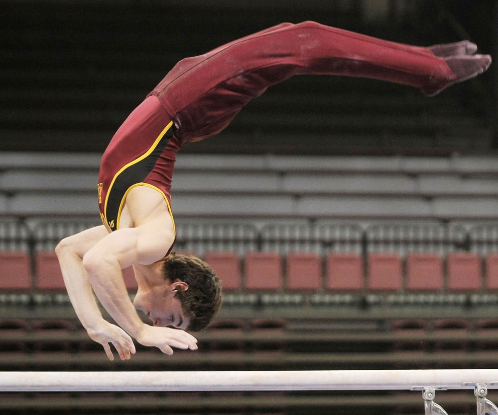 Minnesotas gymnast Ellis Mannon performs his parallel bars routine March 2, 2013, at the Sports Pavilion.