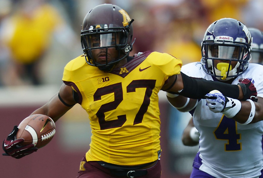 Minnesota running back David Cobb protects the ball from Western Illinois on Saturday, Sept. 14, 2013, at TCF Bank Stadium.