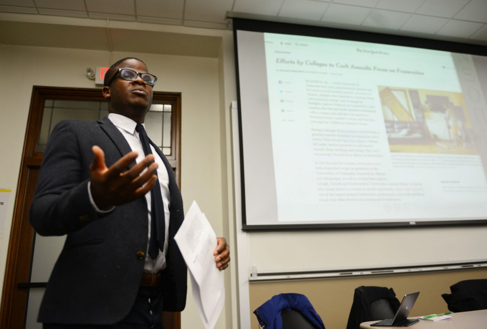 Phi Beta Sigma Vice President George Darvehn leads and mediates a discussion about masculinity in the Greek community in Fraser Hall on Thursday evening. 
