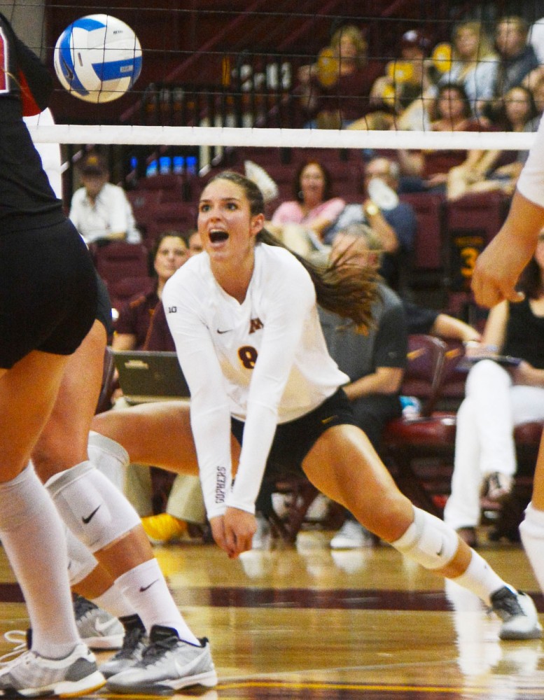 University of Minnesota outside hitter Sarah Wilhite lunges for the ball Saturday night at the Sports Pavilion.