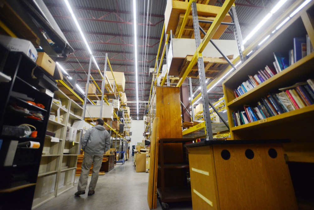 A customer browses used goods at the ReUse center in the Southeast Como neighborhood on Thursday. The ReUse Program collects surplus items from 250 Twin Cities campus buildings and redistributes them to University departments, providing access to the public every Thursday.