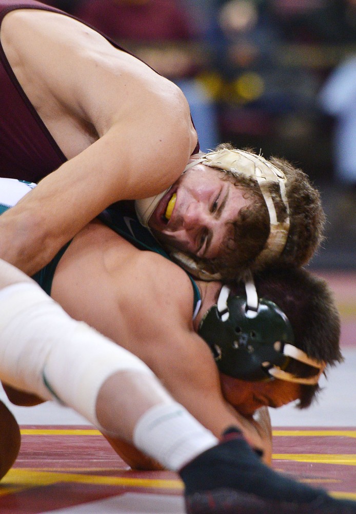 Minnesotas Dylan Ness tries to take down Michigan States Dan Osterman on Sunday, Feb. 3, 2013, at the Sports Pavilion.