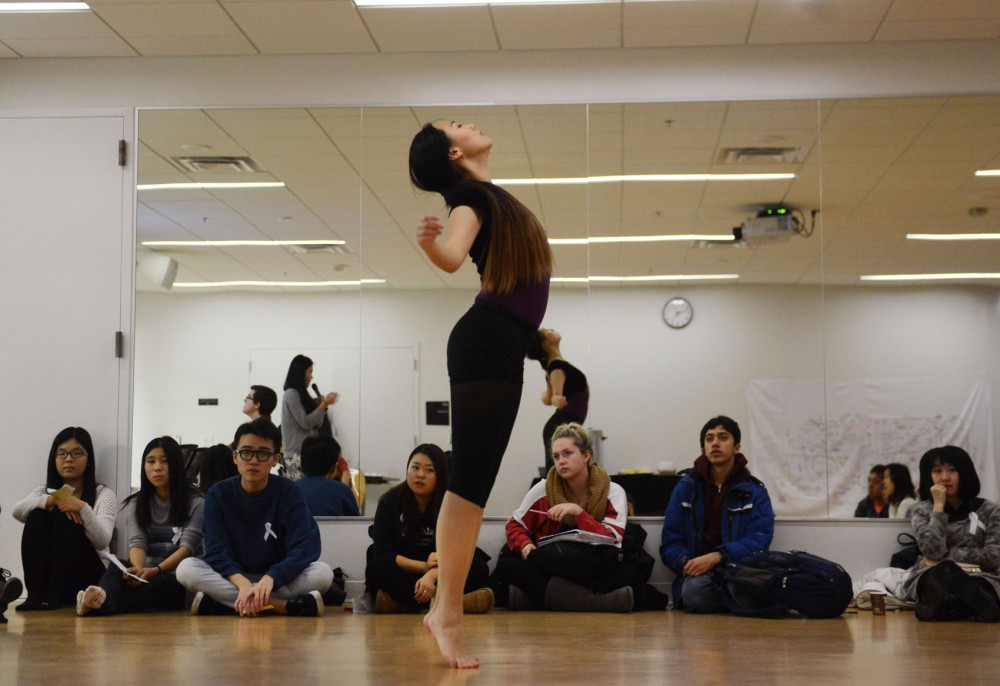 Junior and Women of Asia event coordinator Ziyi Zhao dances to the stories shared by students at the Recreation Center Friday evening. Women of Asia hosted its first event informing students how to say no to relationship violence.