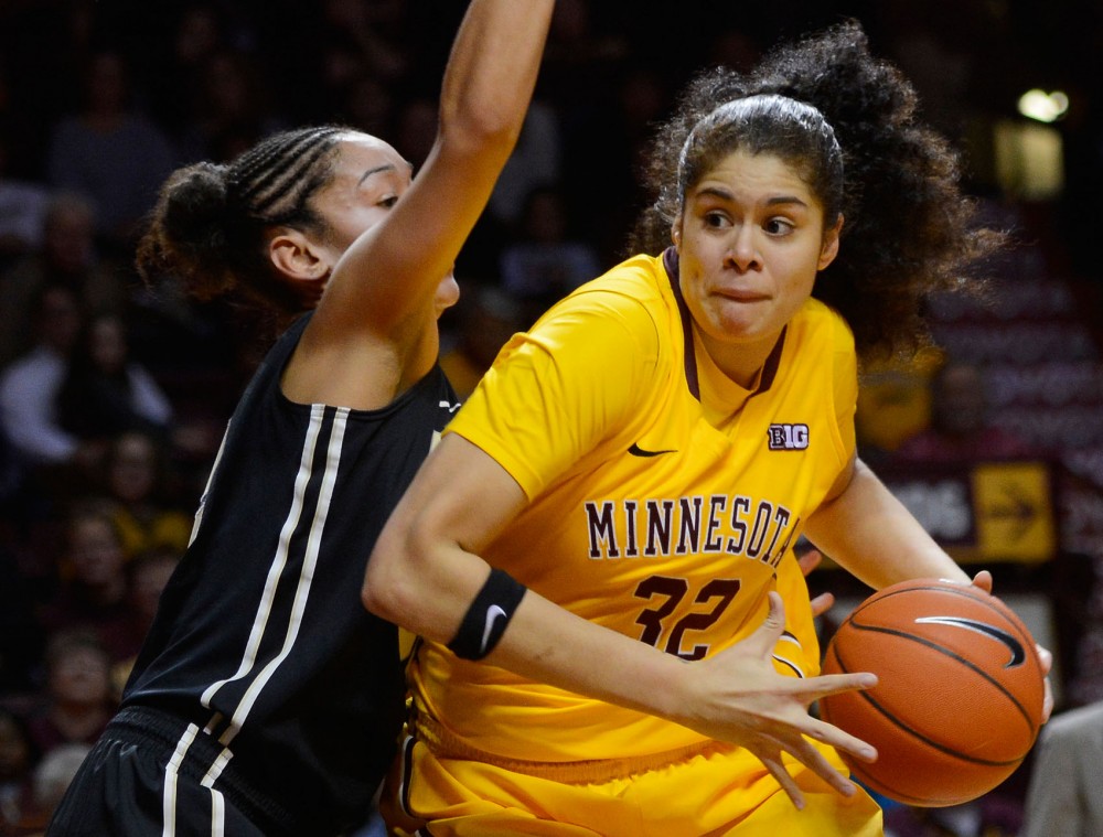Gophers center Amanda Zahui B. runs the ball past Purdue at Williams Arena on Thursday. Purdue beat Minnesota by two points in overtime 90-88.