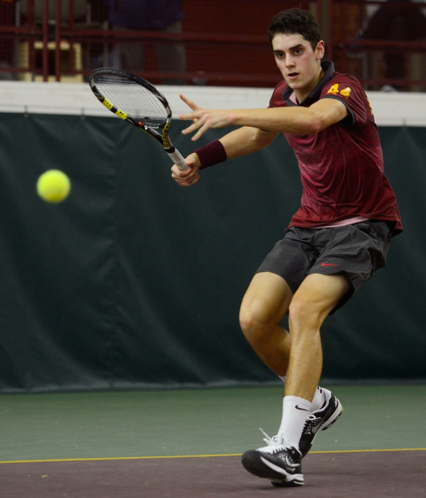 Freshman Felix Corwin volleys the ball at the Baseline Tennis Center on Friday against Washington.