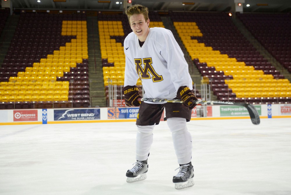 Junior Mike Reilly poses at Mariucci Arena Wednesday afternoon. Reilly, his father and his four siblings all played or are currently involved in collegiate hockey.