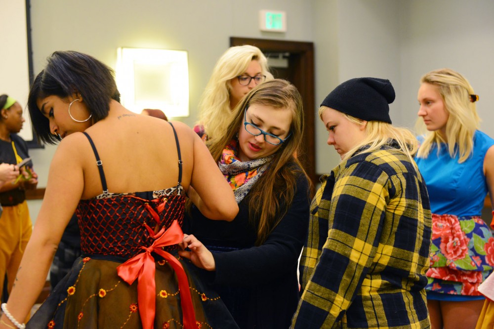 Apparel Design sophomore Sinead Kelly prepares her model at The Westin Edina Galleria on Sunday morning. Kelly and other local designers will be showing their spring line on April 3rd.
