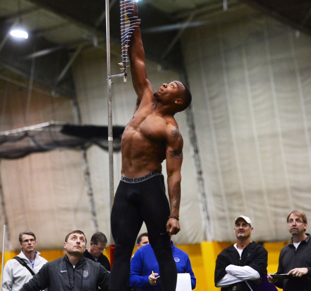 Senior Cedric Thompson performs the vertical jump during Pro Day at the Gibson-Nagurski Football Complex on Monday. 