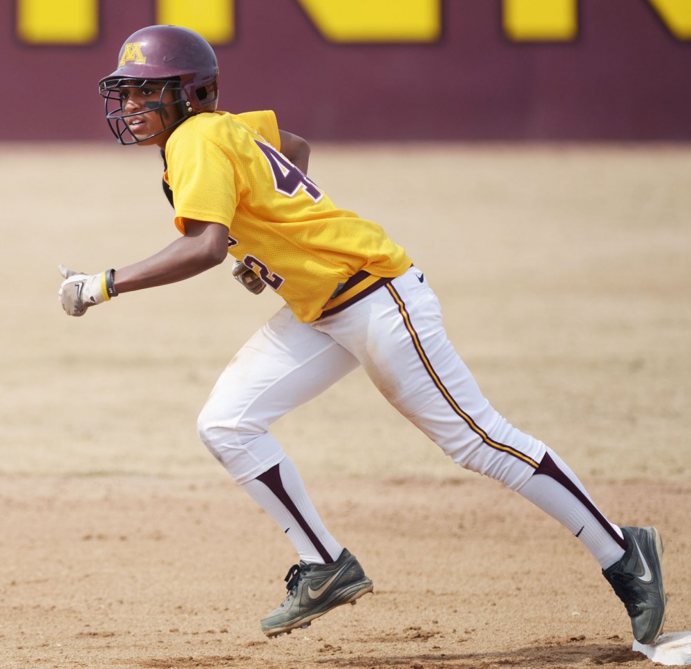 Minnesota infielder Tyler Walker attempts to steal a base against Wisconsin on April 7, 2013, at Jane Sage Cowles Stadium.