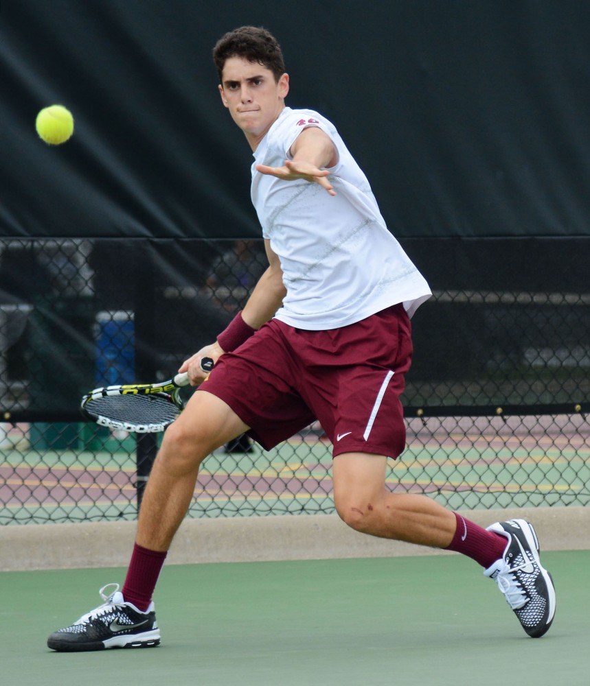 Freshman Felix Corwin returns a shot at the Baseline Tennis Center on Sunday afternoon.