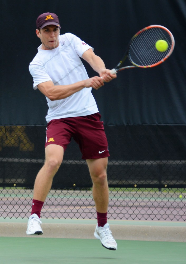 Freshman Matic Spec returns a shot at the Baseline Tennis Center on April 19.