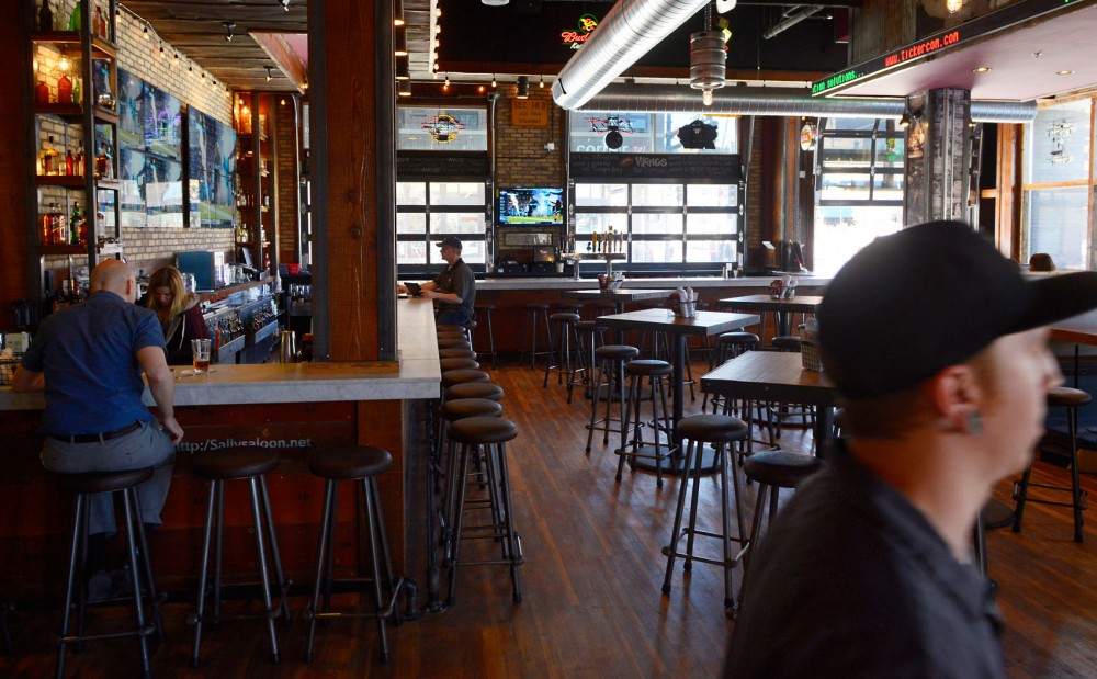 Patrons at Sallys Saloon in Stadium Village visit the newly remodeled restaurant on Monday. The establishment re-opened its doors after construction forced it to close for more than a year.