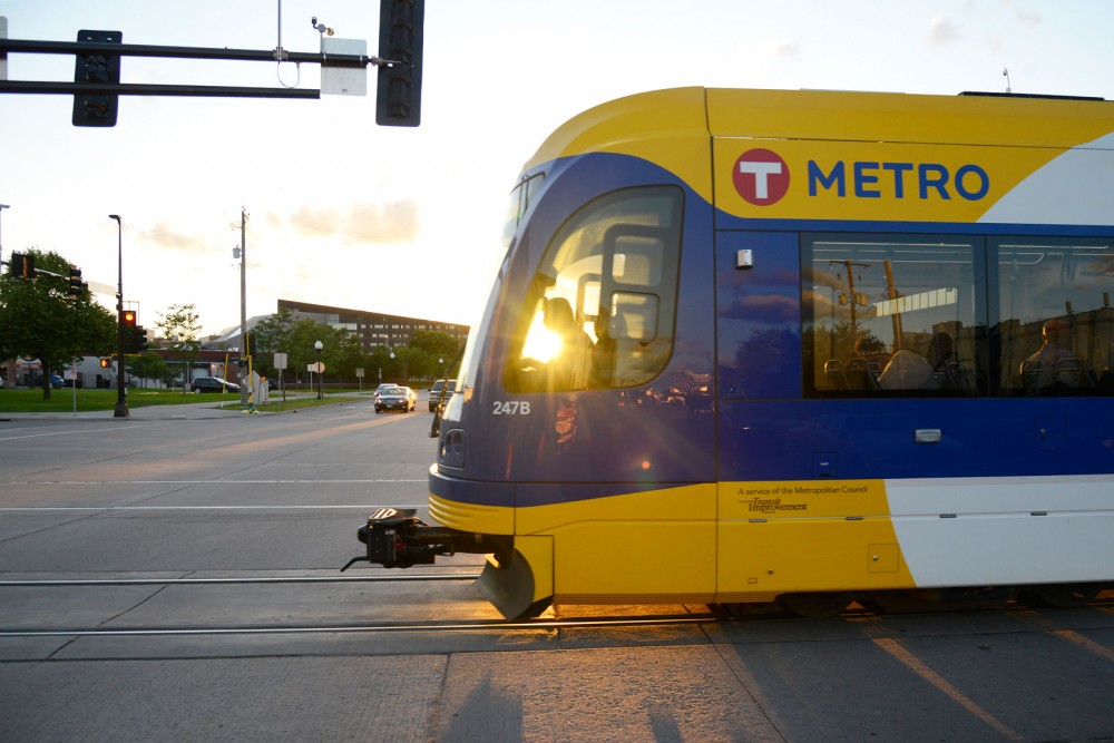 A light rail Green Line train crosses University Avenue in Minneapolis on Monday night. According to Metro Transit, there has been about $3 billion in development along the Green Line corridor since construction began in 2010.