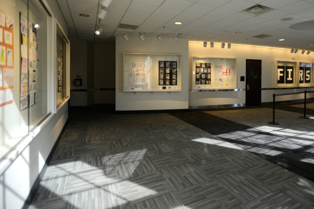 Art created by incoming first year students hangs in the Coffman Art Gallery as a part of the Design Your First Year exhibit of on Saturday, September 5. Students were asked to represent what they hoped to get out of their first year, looking forward to new experiences.