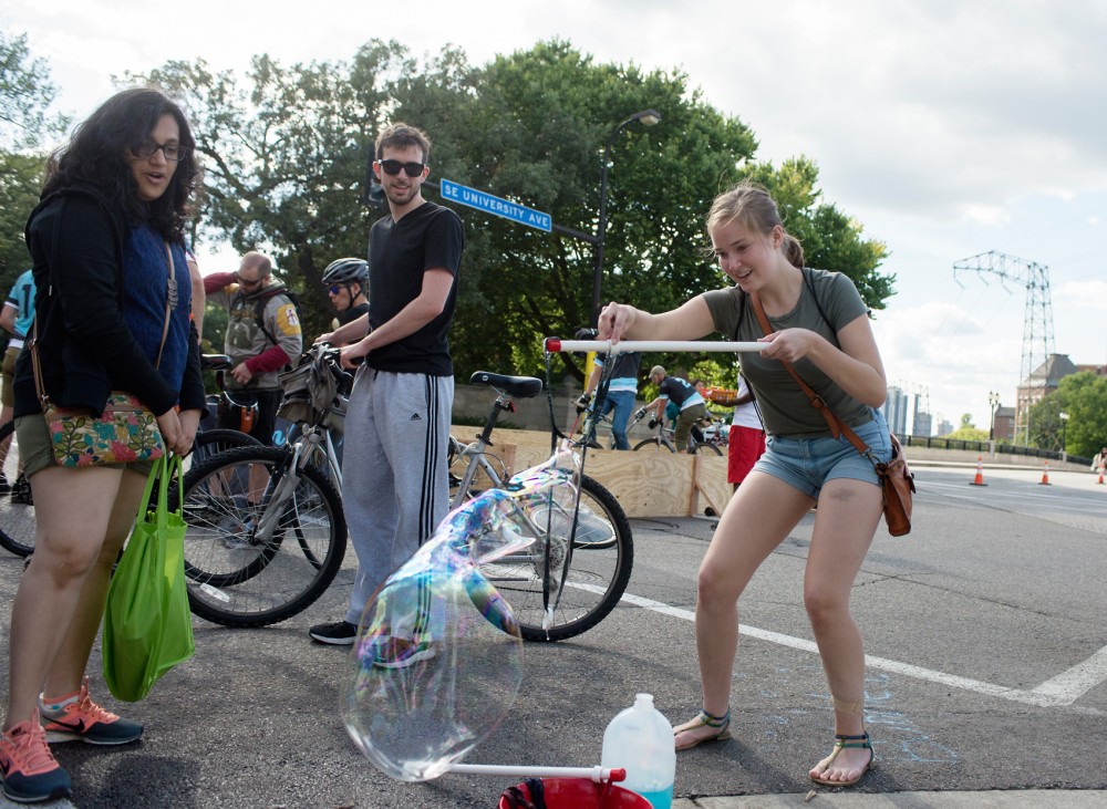 Sophomore Moretta OConnell makes a giant bubble on Saturday during Open Streets on SE University Ave. 