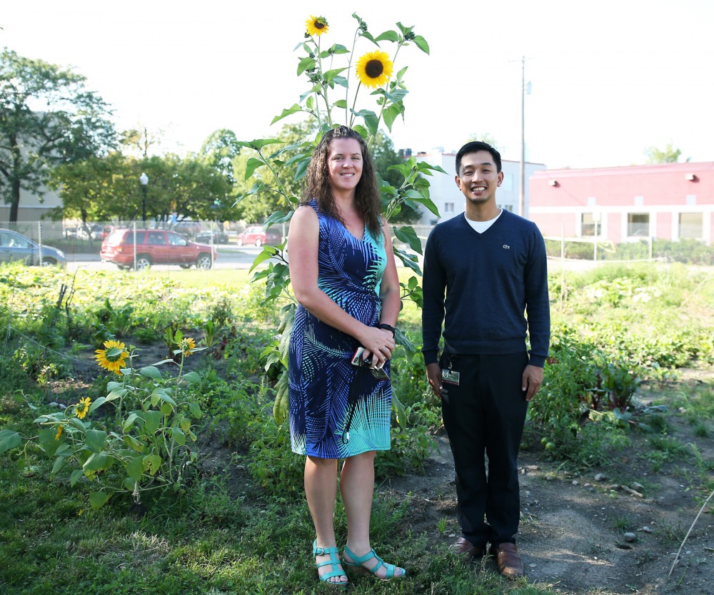 Adult Rehabilitative Mental Health Services program manager, Melissa Flores Floravanti, and practitioner Peter Dinh, pose in the new garden at the Community-University Health Care Center. The new garden will be used by mental health patients in the clinic as a place to relax and socialize. 
