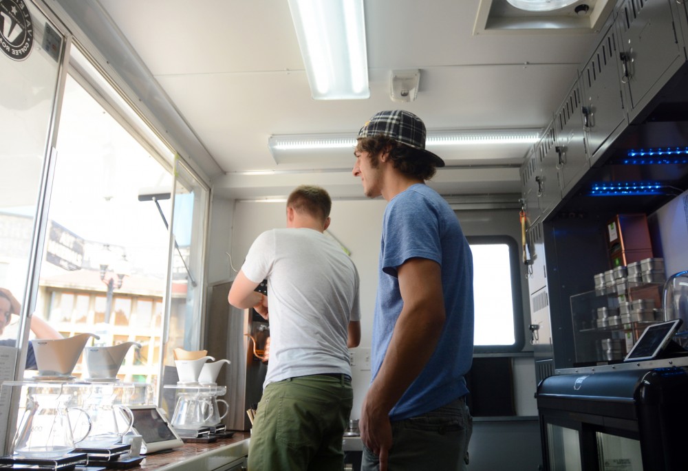 Alex Boehm (left) and Marcus Parkansky, cofounders of Misfit Coffee Company, prepare orders for customer on Tuesday in Dinkytown. 