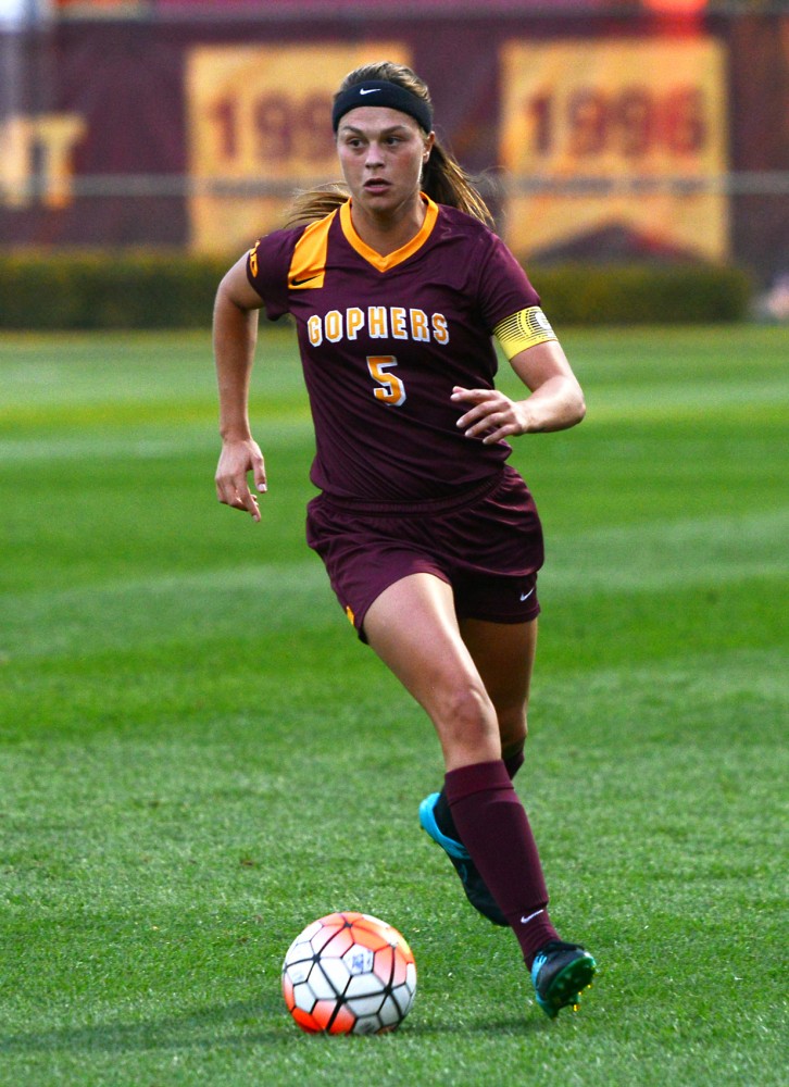 Senior Haley Helverson dribbles the ball down the field at Elizabeth Lyle Robbie Stadium on Friday Sept. 11.
