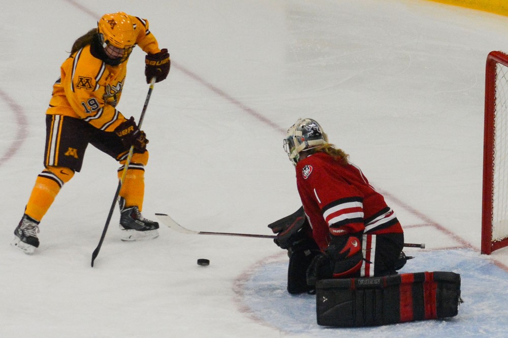 Gophers forward Kelly Pannek scores a goal against St. Cloud State during the second period at Braemar Arena on Monday Nov. 2014.