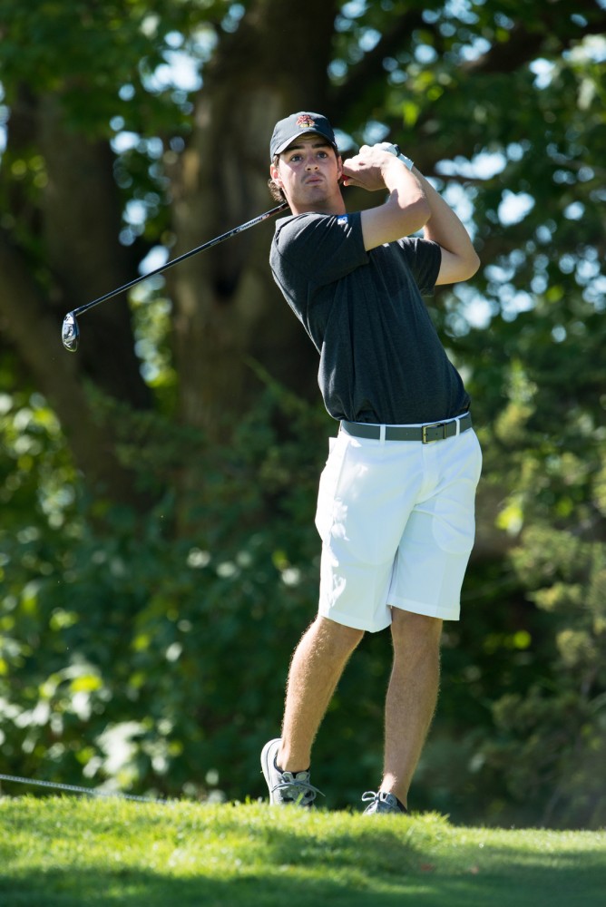 Junior Grady Meyer drives the ball at the Windsong Golf Club during the Gopher Invitational on Sunday morning.