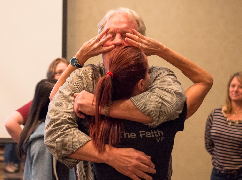 Instructors Al Horner and Karla Rapp of Not Me!: Empowering People and Saving Lives demonstrate proper self-defense techniques for attendees during a free class for University of Minnesota women in the Commons Hotel on Sunday evening.