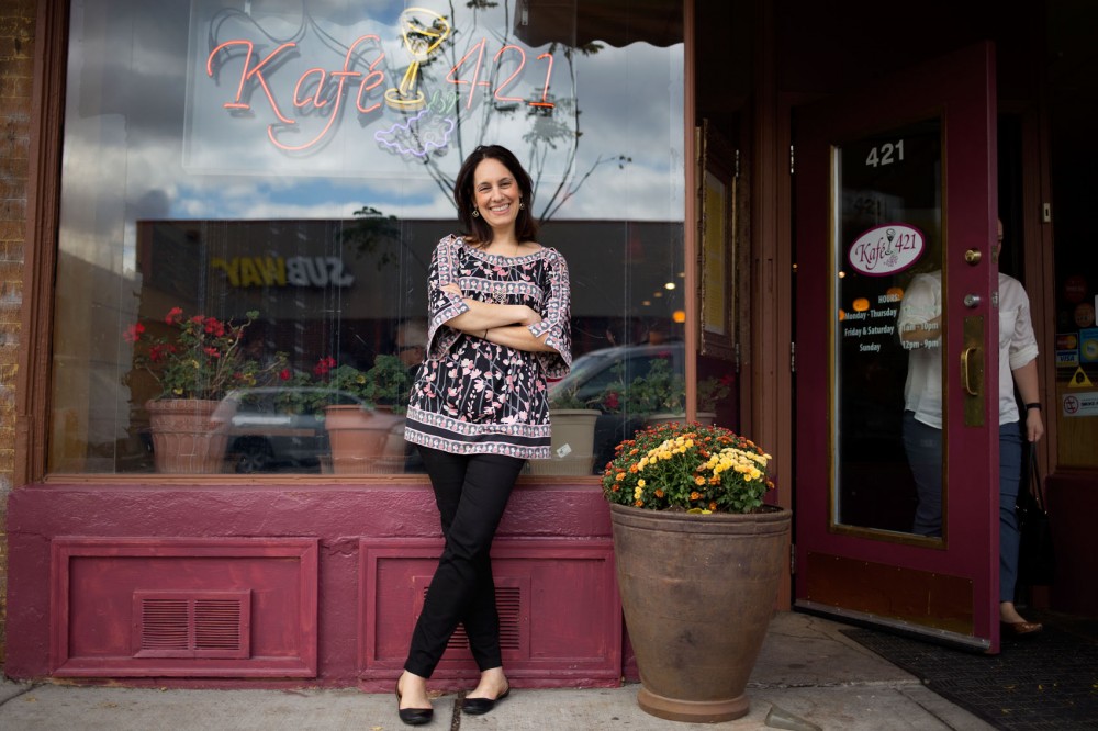 Antigoni Tig Sander McCloud poses outside of Kafe 421 in Dinkytown on Saturday afternoon. In addition to her managerial position at Kafe 421, she regularly appears as a food personality on the local television program Twin Cities Live and has recently become a finalist in a competition to co-host one episode of the Rachael Ray Show.