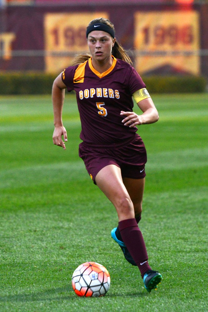 Senior Haley Helverson dribbles the ball down the field at Elizabeth Lyle Robbie Stadium on Friday, Sept. 11.