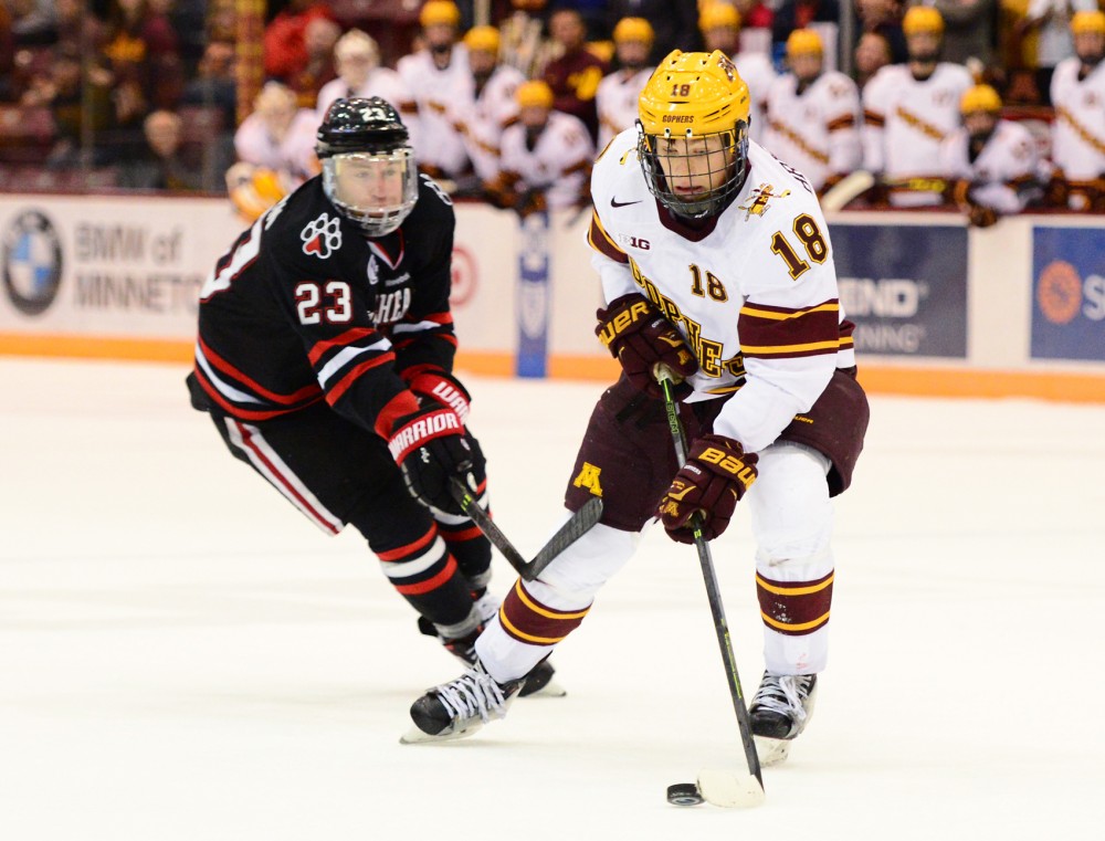 Forward Leon Bristedt handles the puck while playing against Northeastern in Mariucci Arena on Saturday, Oct. 24, 2015. 