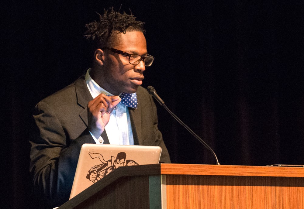 Javaris Bradford, president of the Black Student Union, speaks at their annual Unity Dinner in Coffman Union on Sunday. The group is planning a call to action to bring attention to the importance of the ethnic studies department.