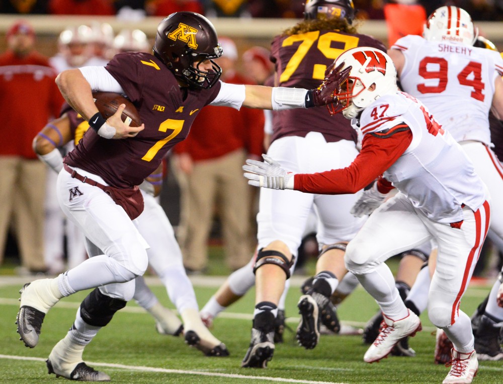 Minnesota quarterback Mitch Leidner faces pressure from Wisconsin while running the ball at TCF Bank Stadium on Saturday where the Gophers fell to the Badgers 31-2.