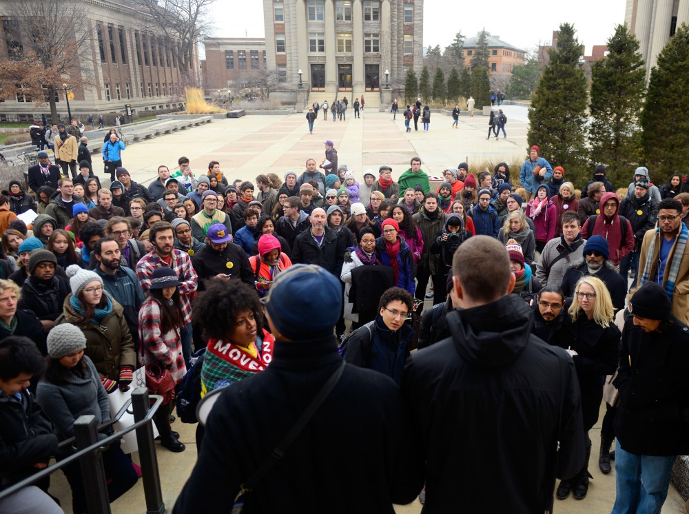 Nicholas Goldsmith, a representative from the Council of Graduate Students, speaks to a crowd at the Whose Diversity? rally outside of Morrill Hall on Friday. The group and its allies stood in solidarity with students who were arrested while occupying Morrill Hall in 2014 prior to their hearing in Lind Hall later that evening.