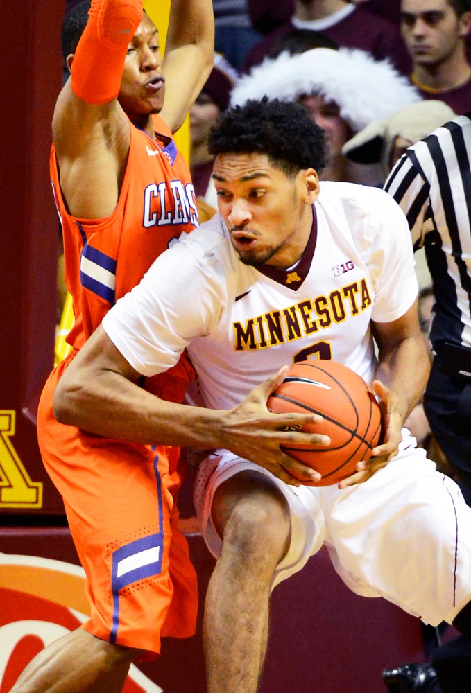 Gophers forward Jordan Murphy moves the ball around the Clemson Tigers in Williams Arena on Nov. 11.