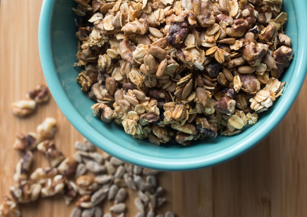 Savory granola with oats, sunflower seeds, walnuts and spices is a delicious topping for salads and soups.