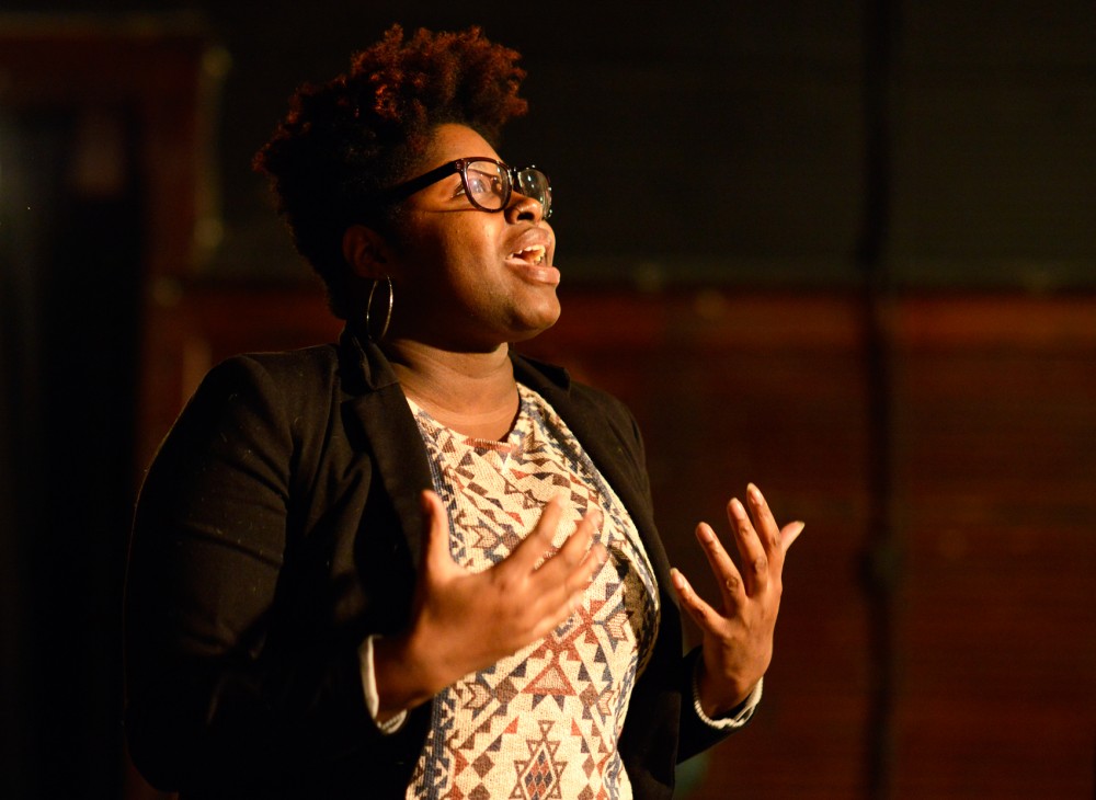 Robin Wonsley speaks about the challenges Black men face living in the Twin Cities, which is rated among the worst cities in the nation for racial disparity. She urged attendees to sign a petition that called for a $15 per hour minimum wage in Minneapolis at a community discussion hosted by the West Bank Community Coalition in the Mixed Blood Theatre in 2016.