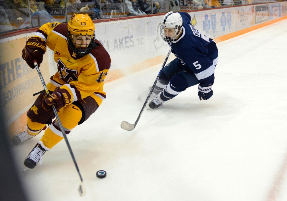 Gophers forward Taylor Cammarata handles the puck while playing against Penn State at Mariucci Arena on Saturday night. Minnesota fell to Penn State with a final score of 3-5. 