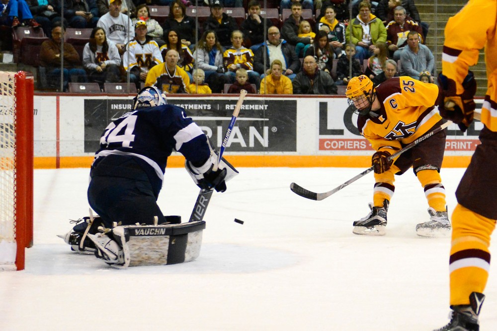 Gophers forward Justin Kloos scores a goal against Penn State at Mariucci Arena on Feb. 6.
