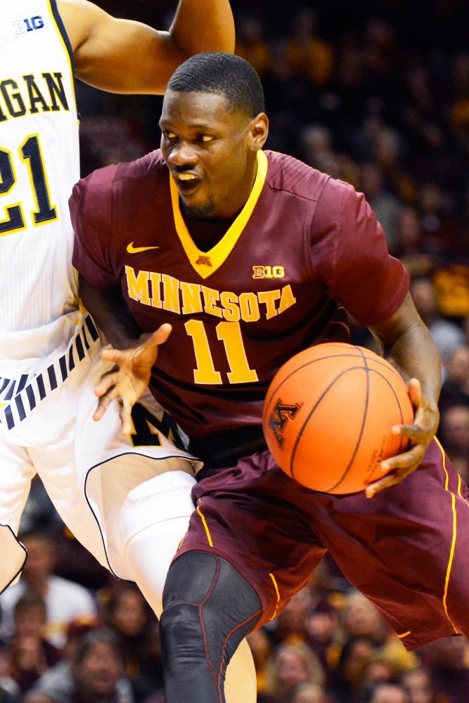 Gophers senior Carlos Morris runs the ball down the court at Williams Arena on Wednesday, Feb 10.