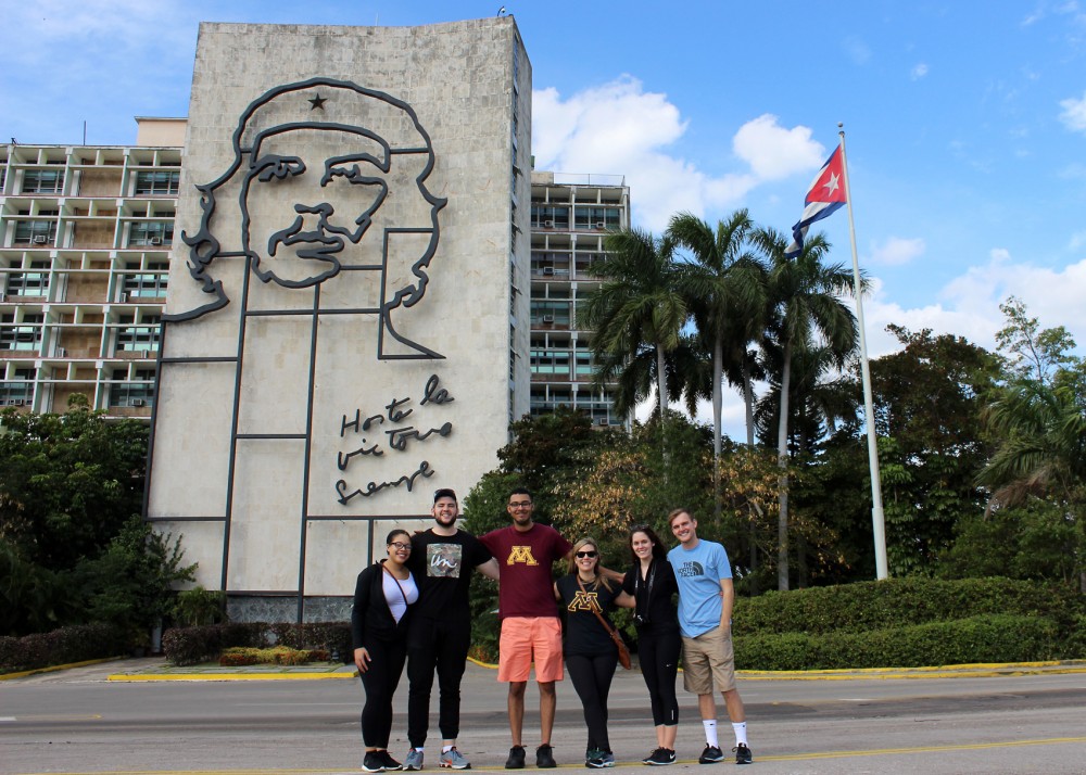 Carlson School of Management students pose in front of Che Guevaras image at the Plaza de la Revolución in Havana, Cuba over spring break as a part of a University course, Introduction to Entrepreneurship, which allows students to pitch ideas to foreign businesses.