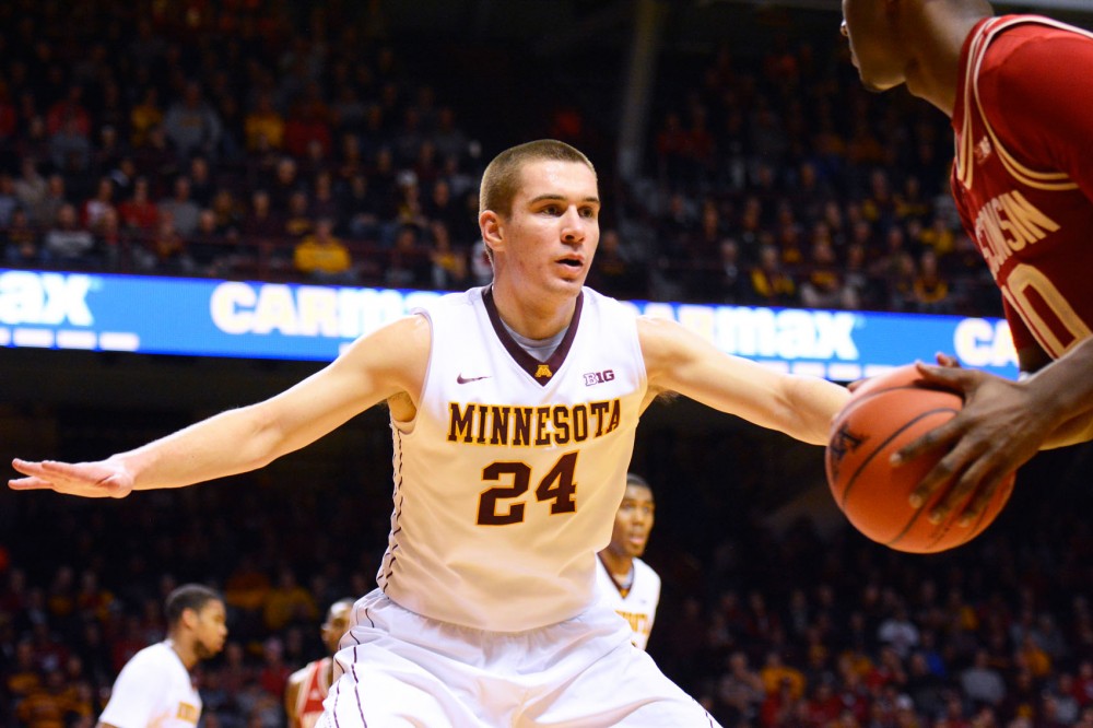 Gophers forward Joey King blocks Wisconsin during his final game in Williams Arena on Wednesday night. 