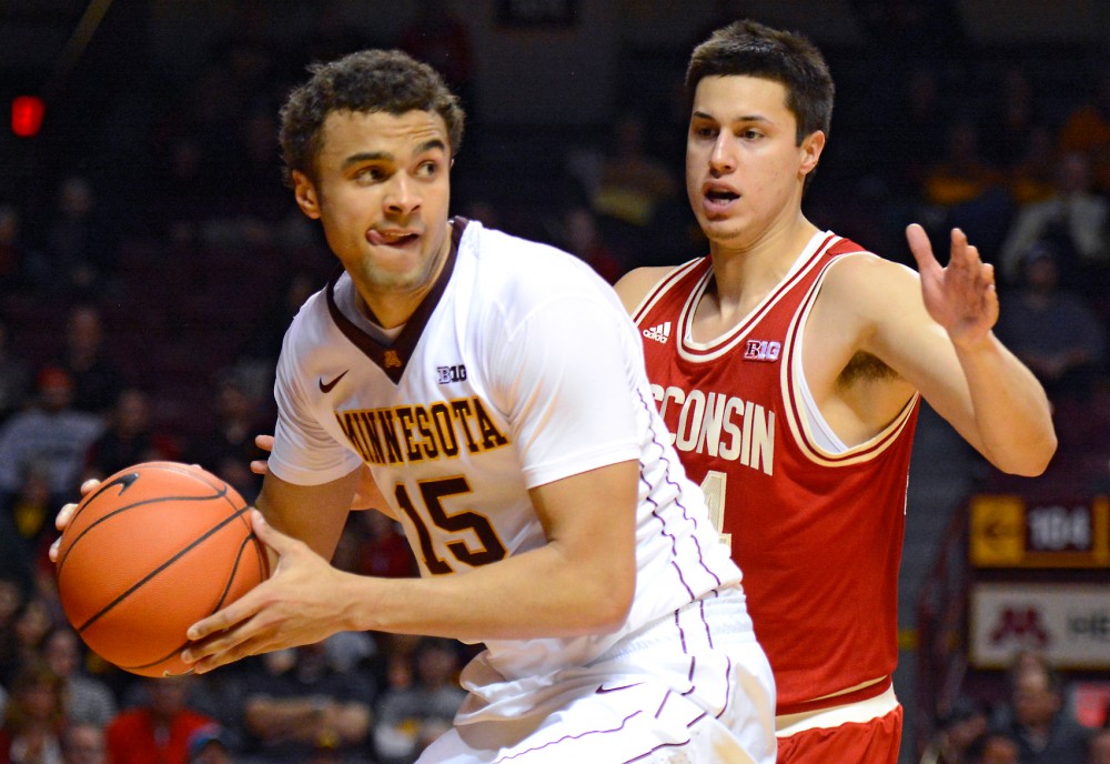 Freshman Stephon Sharp guards the ball from Wisconsin at Williams Arena on Wednesday.
