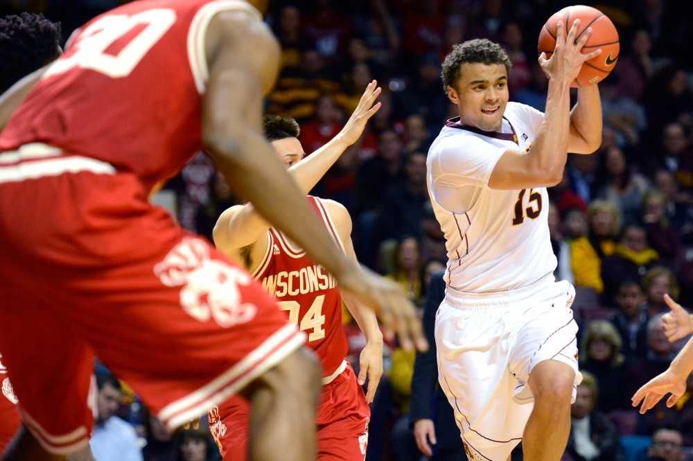 Freshman guard Stephon Sharp protects the ball from Wisconsin at Williams Arena on Wednesday, Mar. 2.